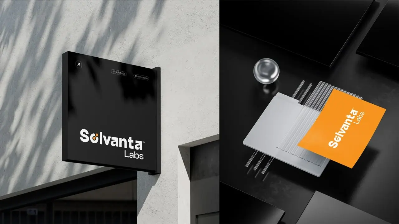 Solvanta Labs exterior signage and orange stationery