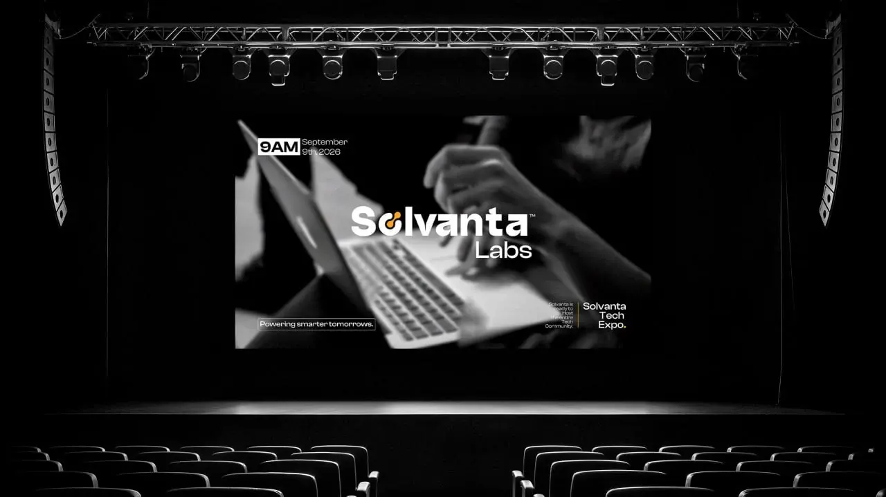 Solvanta Labs identity on a presentation-stage screen